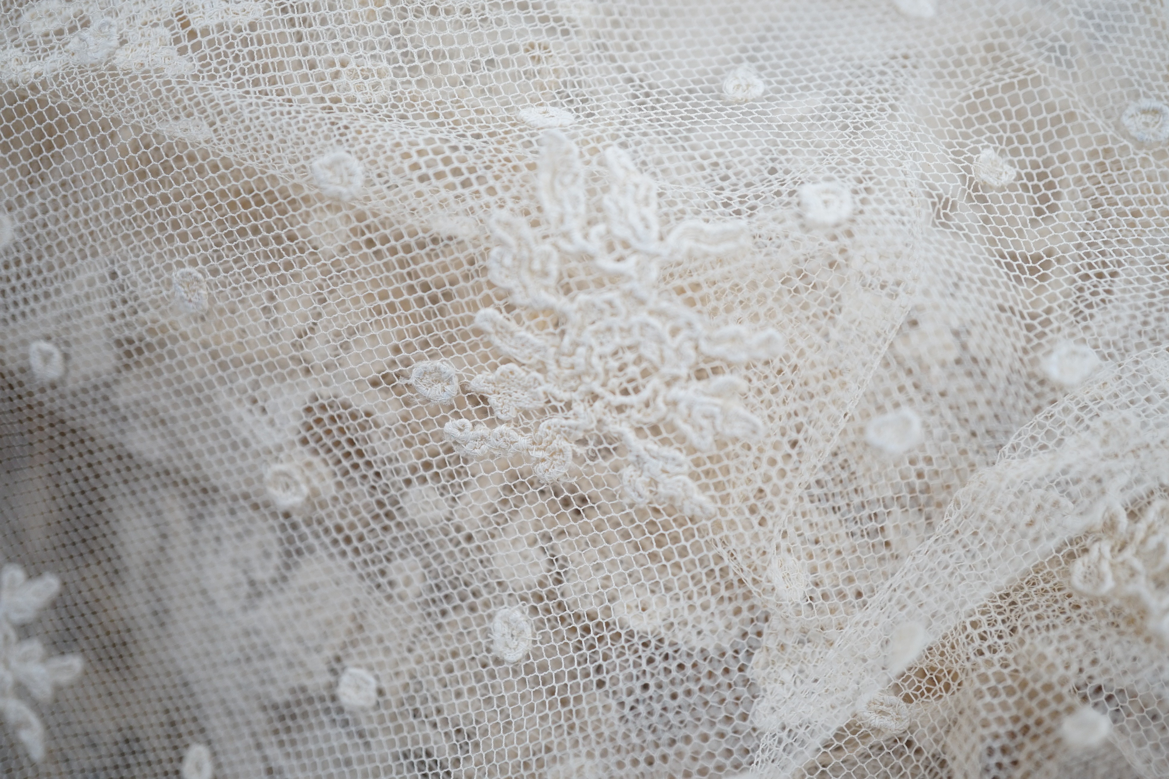 A rare length (9 and a half yards) of Brussels 19th century needle lace, some repairs and damage, circa 1880 and a similar wedding veil